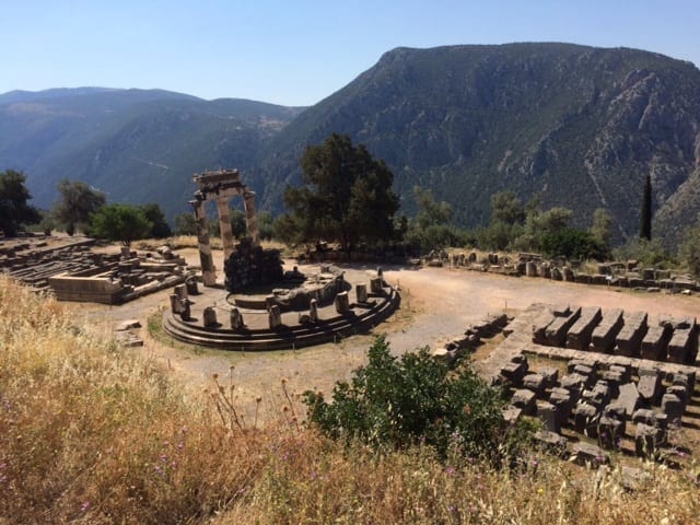 The circular temple at Athena Pronaia Sanctuary at Delphi, the navel of the universe in the ancient Greek world, likely honored an even more ancient earth goddess. Photo by Grove Harris. The circular temple at Athena Pronaia Sanctuary at Delphi, the navel of the universe in the ancient Greek world, likely honored an even more ancient earth goddess. Photo by Grove Harris.